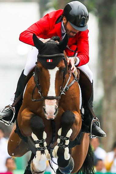 Alonso Valdez Prado of Peru participates in the Lima 2019 jumping final at the Army Equestrian School