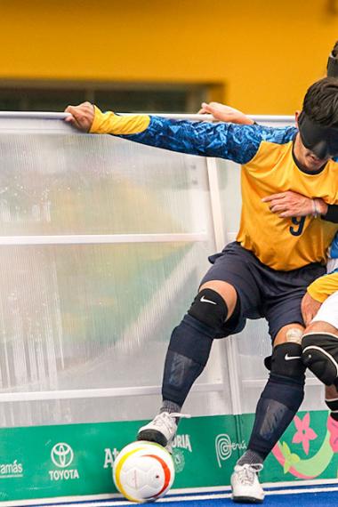 Thiago Da Silva from Brazil fighting for the ball with Argentinian player during the Lima 2019 football 5-a-side competition at the Villa María del Triunfo Sports Center