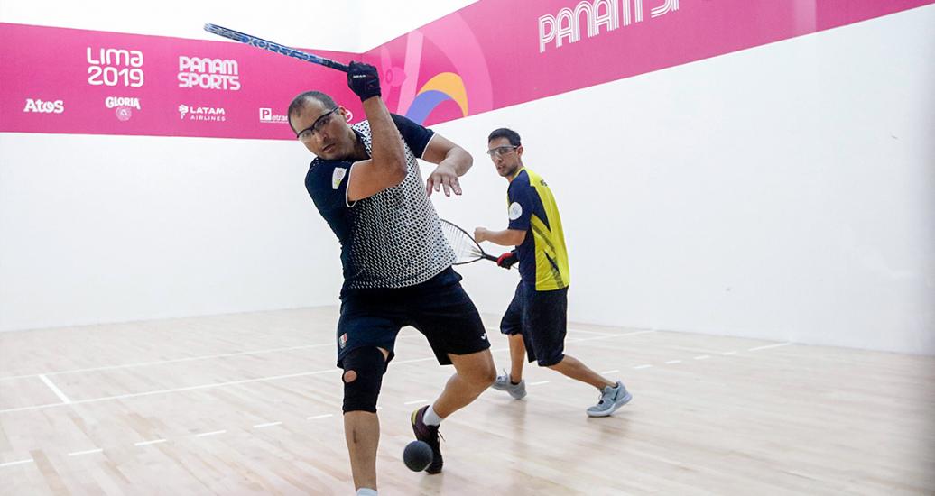 Alvaro Beltran from Mexico hits the ball against Fernando Rios from Ecuador in the racquetball match held at the Callao Regional Sports Village at Lima 2019