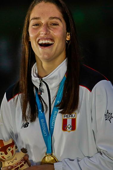 Natalia Cuglievan with her gold medal in water ski trick event
