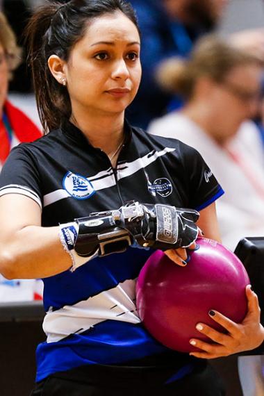 Eugenia Quintanilla holds the ball to throw it on the bowling lane