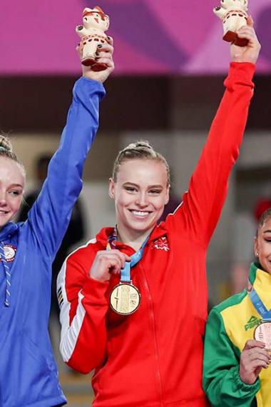 Riley MC Cusker, Elsabeth Black, and Flavia Saraiva show her medals after winning the artistic gymnastics competitions at Lima 2019 in Villa El Salvador Sports Center 