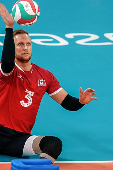 Canadian Austin Hinchey focused on the ball in Lima 2019 sitting volleyball match against Colombia held at the Callao Regional Sports Village