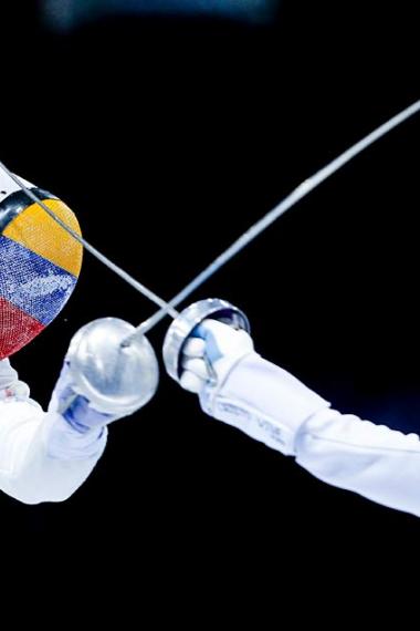 Venezuelan Rubén Limargo goes up against Cuban Yunior Reytor in the men’s fencing semifinals