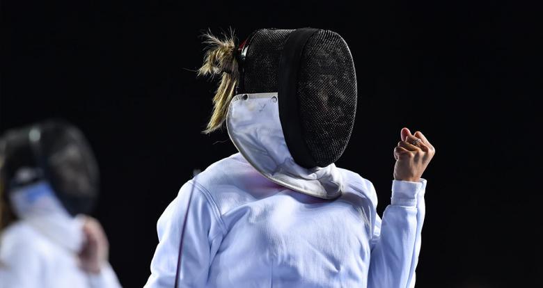 Guatemala’s Maria Diéguez clenches a fist to celebrate victory in fencing event for Modern Pentathlon 
