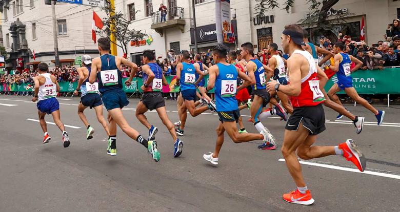 Athletes run on the road for the Lima 2019 marathon