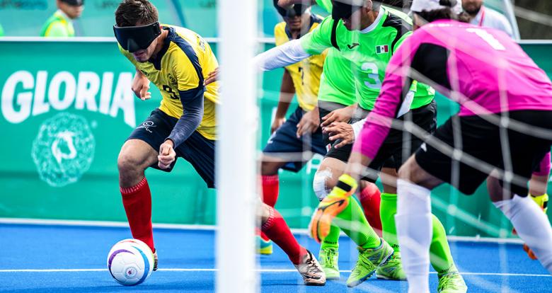 John González from Colombia vs. Jose Cerezo from Mexico in football 5-a-side match at Villa María del Triunfo Sports Center at Lima 2019.