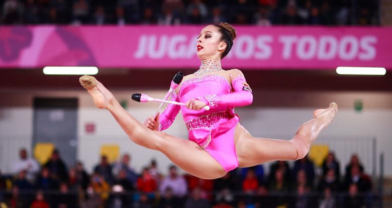 Colombian gymnast Lina Dussan performing a pirouette at the Villa El Salvador Sports Center in Lima 2019