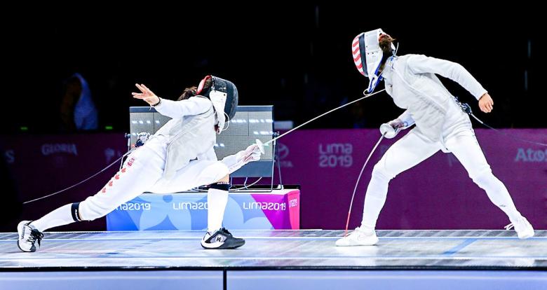 Canadian Jessica Guo and American Lee Kiefer fight a bout during the women’s individual foil final at the Lima Convention Center