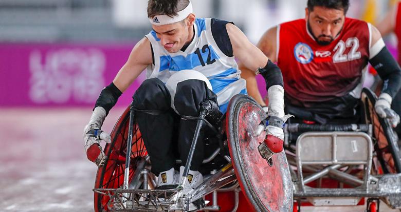 Argentinian Mariano Gastaldi holds the ball in the Lima 2019 wheelchair rugby match against Chile at the Villa El Salvador Sports Center