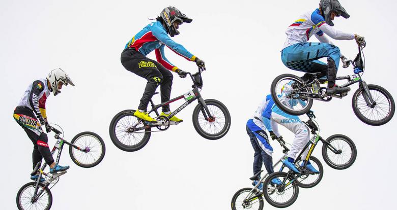 BMX racers meet mid-air during the Lima 2019 quarterfinals at Costa Verde San Miguel
