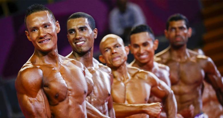 The Mexican Carlos Suarez, the Ecuadorian Angelo Ronquillo Carpio, the Costa Rican Evaristo Cortes, the Guatemalan Jonathan Martinez Catalan, and the Nicaraguan Jorge Callejas posing during the bodybuilding competition at Lima 2019.	
