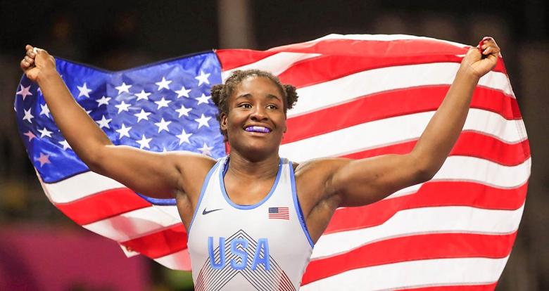 Tamyra Mensah smiling with the U.S. flag after winning the gold medal in Lima 2019 freestyle wrestling event at the Callao Regional Sports Village. 