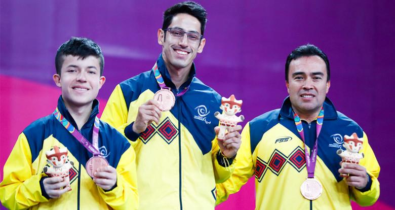 Alvaro Puerto, Diego Jimenez and Julian Chinchilla from Colombia showing their medals on the podium after Lima 2019 Para table tennis competition at the National Sports Village - VIDENA