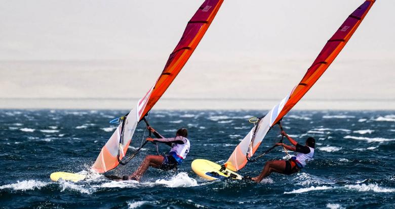 Celia Tejerina of Argentina and María Bazo of Peru compete for medals in the Lima 2019 women’s windsurf at Paracas Bay