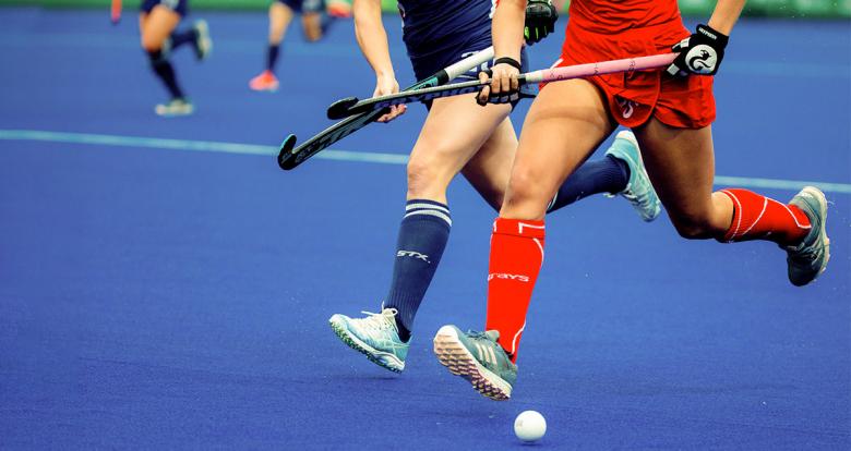 Chile and USA go for the ball in the Lima 2019 hockey match for the bronze medal at the National Sports Village (VIDENA)