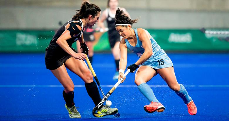 Argentinian Maria Jose Granatto faces off a Canadian athlete during the Lima 2019 hockey match for the gold at the National Sports Village (VIDENA)