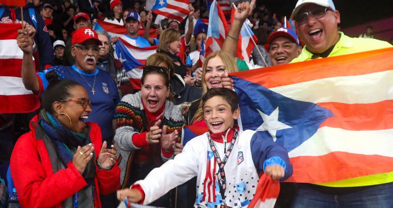 Puerto Rican fans celebrating the gold won by Adriana Diaz at the Lima 2019 women’s table tennis final held at the National Sports Village – VIDENA.