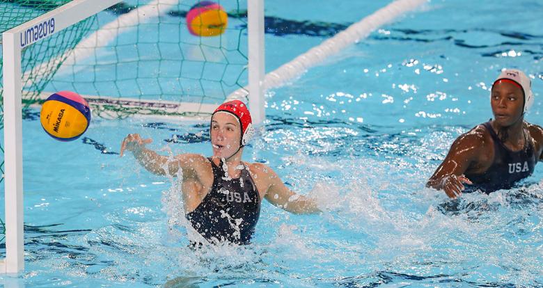 USA’s Kiley Neushul and Ashleigh Johnson competing against Peru in Lima 2019 water polo competition at the Villa Maria del Triunfo Sports Center.