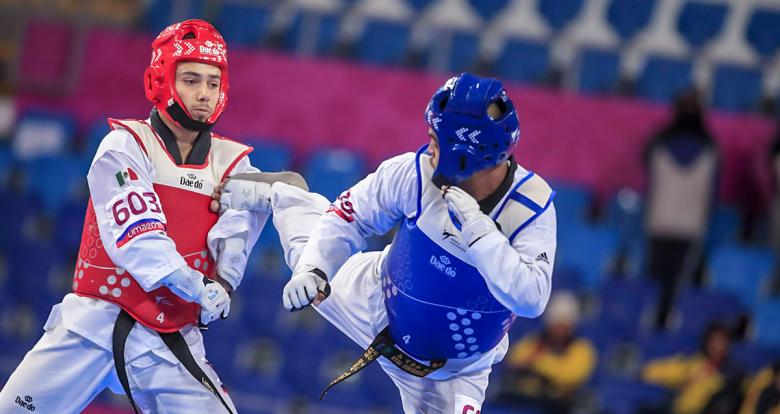 Edgar Torres from Mexico and Dayan Sosa from Cuba compete for the bronze in men’s Para taekwondo K44 +75 kg at the Callao Regional Sports Village.