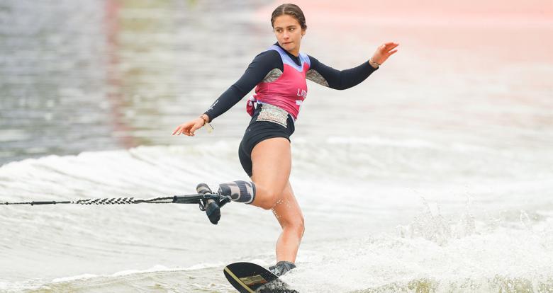 Rini Paige from Canada soars through the air during the Lima 2019 water ski competition at Laguna Bujama.