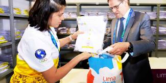 Symbolic uniform delivery to Carlos Neuhaus – Lima 2019 Uniform and Accreditation Center