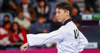 Alex Lee competing in Taekwondo