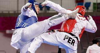 Christian Ocampo from Peru faces Juan Alvarez from Puerto Rico in taekwondo