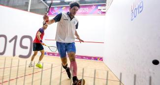 Roberto Pezzota goes after the squash ball 