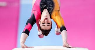 Martina Dominici performs a turn over the vaulting table during artistic Gymnastics exhibition at Lima 2019 in Villa el Salvador Sports Center 
