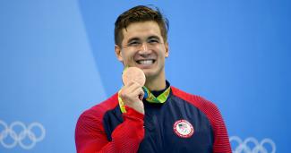 Olympic swimmer Nathan Adrian celebrates his medal win. 