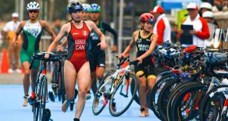 Desirae Ridenour, Cecilia Perez and Elizabeth Bravo rush during triathlon