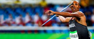 An athlete is about to throw the javelin during an athletics competition. 