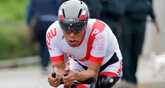 Peruvian Hilario Rimas cycles at full speed in Lima 2019 men’s Para cycling road C1-2 time trial competition at Costa Verde, San Miguel