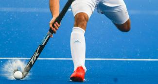 Argentinian Nicolás Cicileo controls the ball in a hockey match against Trinidad and Tobago, held at the Villa María del Triunfo Sports Center at the Lima 2019 Pan American Games