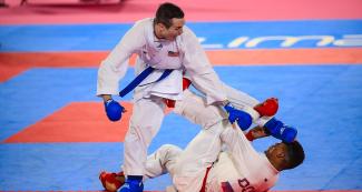 USA’s Thomas Scott performs a move on his opponent, Anderson Soriano from the Dominican Republic at the Lima 2019 Pan American Games, held at the Villa El Salvador Sports Center.