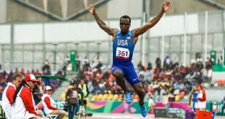 Para athlete Markeith Price from the US soars through the air in the Lima 2019 men’s long jump T13 competition at the National Sports Village - VIDENA