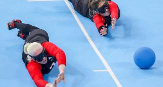 Amy Burke and Maryam Salehizadeh, from Canada, fight for the ball in the goalball match against Peru at the Lima 2019 Parapan American Games in the Callao Regional Sports Village