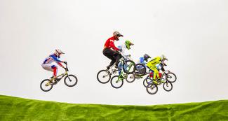 BMX racers of the Americas meet mid-air during the Lima 2019 BMX competition at Costa Verde San Miguel
