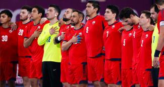 Chilean team singing their national anthem before the handball final against Argentina at Lima 2019