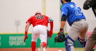 Canadian baseball player Andrew Panas runs to first base during Lima 2019 baseball game against Nicaragua at Villa María del Triunfo Sports Center