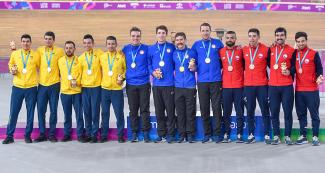 Chile (bronze), Colombia (silver), and USA (gold) teams proudly pose with their medals in Lima 2019 men’s team pursuit event at the National Sports Village (VIDENA)