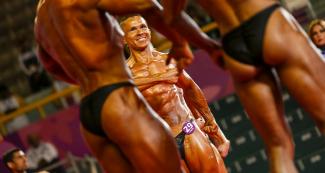 The Colombian Carlos Giraldo Barragan posing during the Lima 2019 bodybuilding competition held at the Chorrillos Military School.	