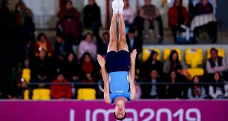 Lucas Adorno from Argentina tumbles through the air in the trampoline competition at the Lima 2019 Games held at the Villa El Salvador Sports Center