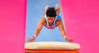 Guatemalan gymnast Jorge Alfredo Vega during artistic gymnastics vault competition at the Villa El Salvador Sports Center