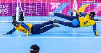 Jose Oliveira and Leomon Da Silva from Brazil defend the goal during goalball match against Mexico at the Callao Regional Sports Village