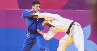 Peruvian judoka Alonso Wong goes up against Mexican Eduardo Araujo in the Lima 2019 men’s -73 kg competition at the National Sports Village – VIDENA