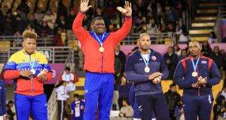 Medalists from Venezuela (silver), Cuba (gold); and Chile and Dominican Republic (bronze) show the medals picked up at the Lima 2019 Greco-Roman wrestling 130 kg event at the Callao Regional Sports Village