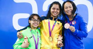 Paola Ruvalcaba from Mexico (silver), Cecilia Araujo from Brazil (gold) and Haven Shepherd from the USA (bronze) proudly smile on the women’s 50m freestyle S8 Para swimming podium at Lima 2019 at the National Sports Village – VIDENA.