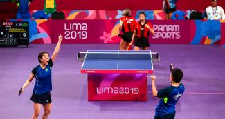 Jessica Yamada and Caroline Kumahara from Brazil celebrating point at the Lima 2019 table tennis match vs. Puerto Rico at the National Sports Village – VIDENA.